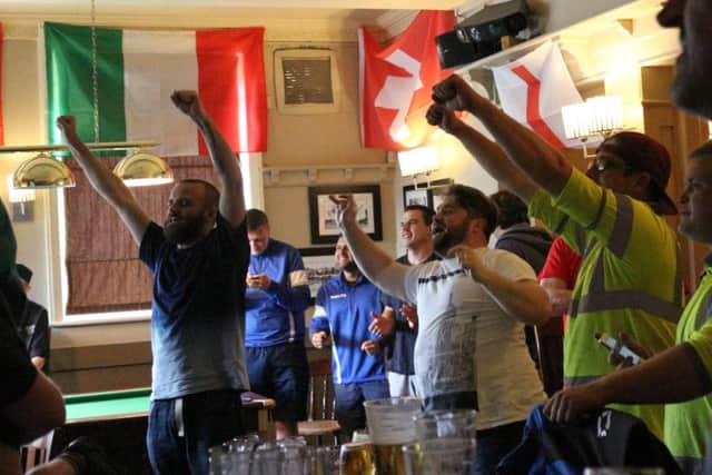 England fans at the Coach & Horses in Hilsea celebrate Daniel Sturridge's injury-time winner Picture: Emma Rossiter