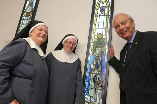 Stained glass windows have been installed at Queen Alexandra Hospital. The Sisters of Bethany from Southsea Sister Mary Joy, left, and Sister Elizabeth Pio with Mick Lyons. Picture: Ian Hargreaves (160841-3)