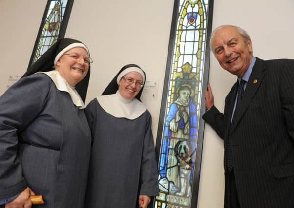Stained glass windows have been installed at Queen Alexandra Hospital. The Sisters of Bethany from Southsea Sister Mary Joy, left, and Sister Elizabeth Pio with Mick Lyons. Picture: Ian Hargreaves (160841-3)