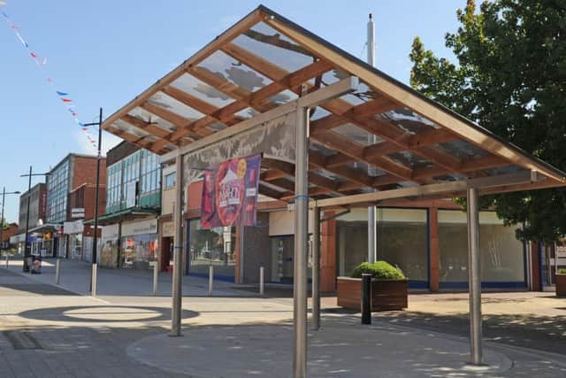 The bandstand in Waterlooville with the betting shop's new home on the corner behind it