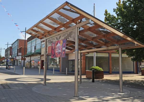 The bandstand in Waterlooville with the betting shop's new home on the corner behind it