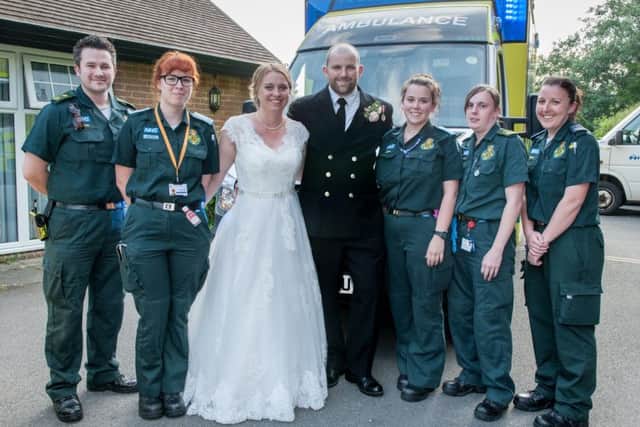 Alice Green with ambulance staff - who helped after Alice's mum collapsed during her wedding