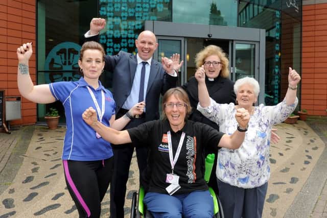 Back from left, fitness instructor Melissa Spiers, John Pounds Centre manager Matt Mason, the Rev Belinda Davies, vicar of St George's Church in Portsea, and Mavis Patterson, with fitness instructor Jude Caunter at the front Picture: Sarah Standing (160890-2705)
