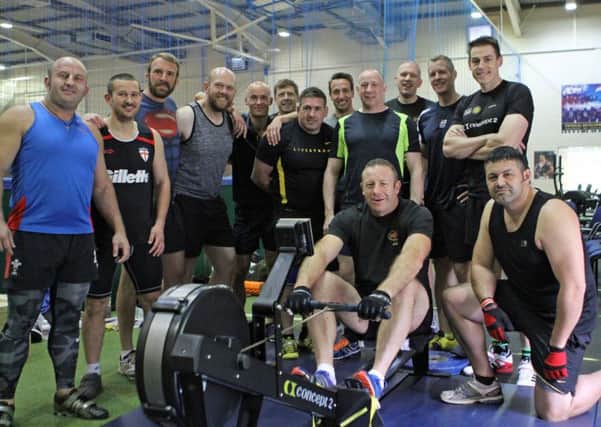 A team made of serving members and veterans from across the navy, army, Royal Air Force and the Sub7 indoor rowing club set a new world and British record