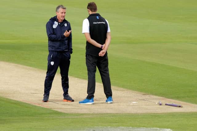 Giles White amid puddles on the Ageas Bowl outfield. Picture: Neil Marshall