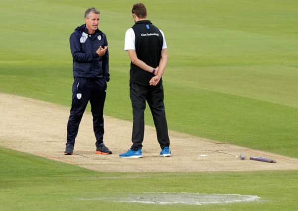 Giles White amid puddles on the Ageas Bowl outfield. Picture: Neil Marshall