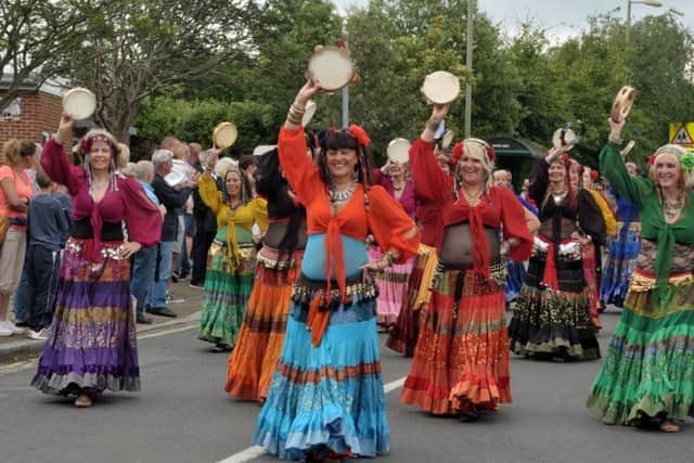 Belly dancers shimmy down the road as the Portchester Gala Parade heads for The Castle Picture: Mick Young (160761-06)
