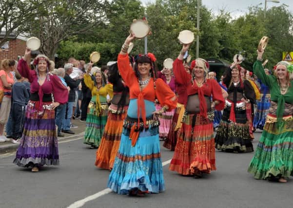 Belly dancers shimmy down the road as the Portchester Gala Parade heads for The Castle Picture: Mick Young (160761-06)