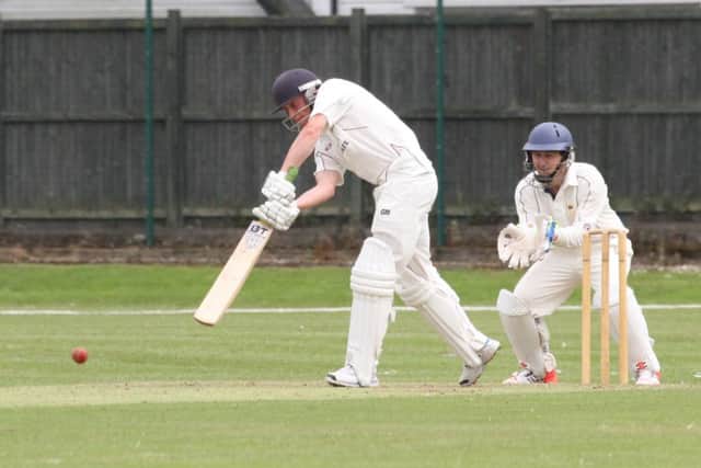 Tom Benfield batting for Portsmouth & Southsea, while Tom May watches on for United Services. Picture: Habibur Rahman (160902_8111)