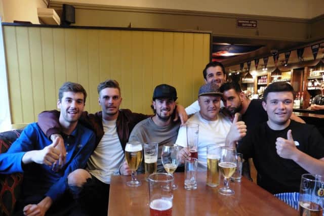 From left, Marlon Parr, 21, Tom Froggatt, 22, Josh Sadler, 23, Bobby Scott, 26, Wesley Bailey, 22, Tony Teef, 22, Max Page, 21, in the Portsbridge Inn for the England game tonight