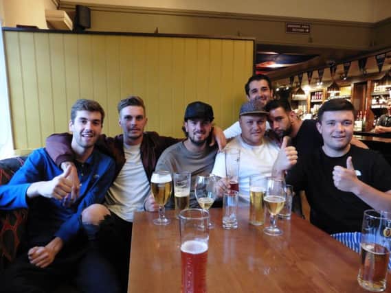 From left, Marlon Parr, 21, Tom Froggatt, 22, Josh Sadler, 23, Bobby Scott, 26, Wesley Bailey, 22, Tony Teef, 22, Max Page, 21, in the Portsbridge Inn for the England game tonight
