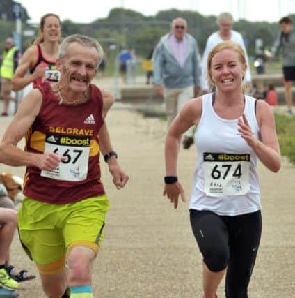 Kelly Fielding, right, running the 5k, alongside Peter Cross. Picture: Mick Young