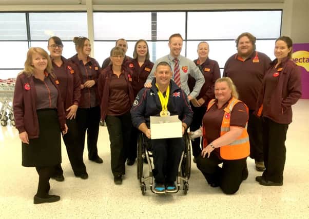 Invictus gold medal-winner Andy McErlean with staff from Sainsburys in Waterlooville