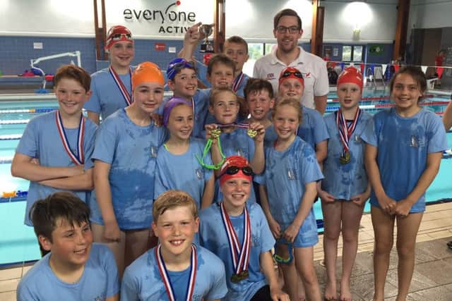 John Molyneaux with the winning swimmers at the schools' gala