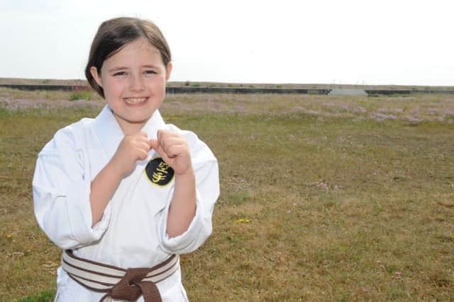 Josie Parrott, nine, from Hayling Island, aims to complete 3,000 karate kicks in an hour at fundraiser for a sarcoidosis charity after her grandmother Dawn Kilburn died of the condition two years ago.
Picture: Sarah Standing (160808-2118)
