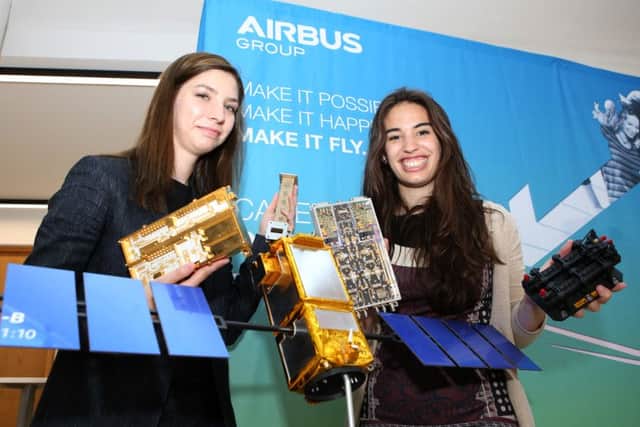 System Engineers Daria Lulia Calangiu and Laila Ramio-Tomas next to a model replica of the Galileo Satellite and some of its components.Picture: Habibur Rahman (160914-23 )