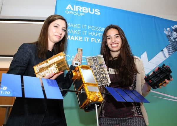 System Engineers Daria Lulia Calangiu and Laila Ramio-Tomas next to a model replica of the Galileo Satellite and some of its components.
Picture: Habibur Rahman (160914-23 )