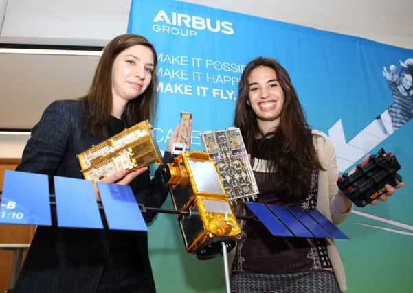 System Engineers Daria Lulia Calangiu and Laila Ramio-Tomas next to a model replica of the Galileo Satellite and some of its components.

Picture: Habibur Rahman (160914-23 )