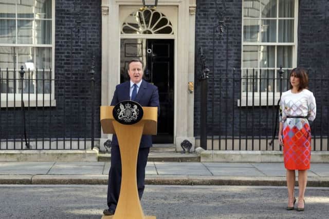 Prime Minister David Cameron speaks outside 10 Downing Street, London, with wife Samantha
Picture: Daniel Leal-Olivas/PA Wire