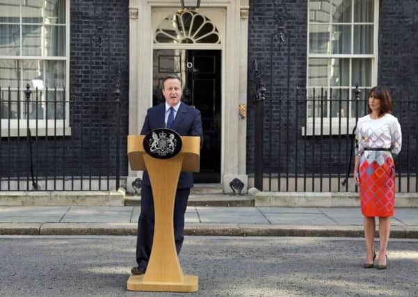 Prime Minister David Cameron speaks outside 10 Downing Street, London, with wife Samantha
Picture: Daniel Leal-Olivas/PA Wire