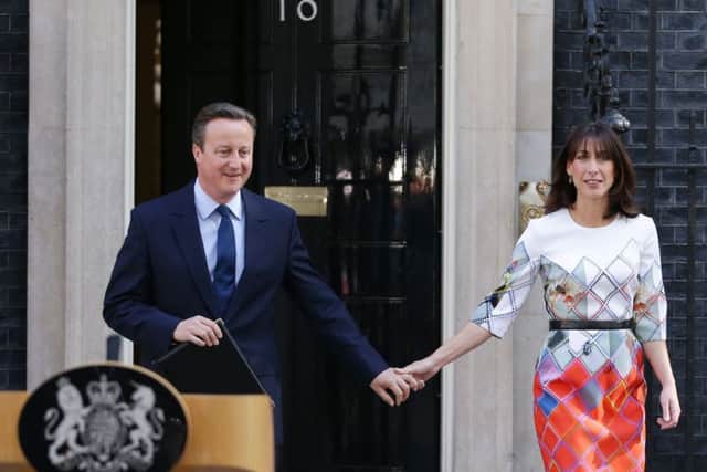 ALTERNATE CROP
Prime Minister David Cameron walks out of 10 Downing Street, London, with wife Samantha where he announced his resignation after Britain voted to leave the European Union in an historic referendum which has thrown Westminster politics into disarray and sent the pound tumbling on the world markets.
PHOTO: Daniel Leal-Olivas/PA Wire POLITICS_EU_091820.JPG