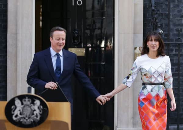 ALTERNATE CROP
Prime Minister David Cameron walks out of  10 Downing Street, London, with wife Samantha where he announced his resignation after Britain voted to leave the European Union in an historic referendum which has thrown Westminster politics into disarray and sent the pound tumbling on the world markets. 
PHOTO: Daniel Leal-Olivas/PA Wire POLITICS_EU_091820.JPG