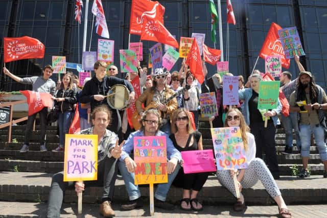 A protest march to save the Arts Lodge in Portsmouth. Front, from left, Charles Harris, founder Mark Lewis,cafe manager  Alison Brett and Megan Linford. Picture: Sarah Standing (160921-4987)