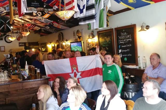 Fans watching the Euro 2016 Wales v Northern Ireland match in Shenanigans Irish Cafe, in Osborne Road, Southsea. PPP-160625-183731001