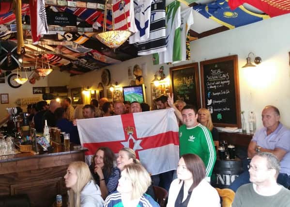 Fans watching the Euro 2016 Wales v Northern Ireland match in Shenanigans Irish Cafe, in Osborne Road, Southsea. PPP-160625-183731001