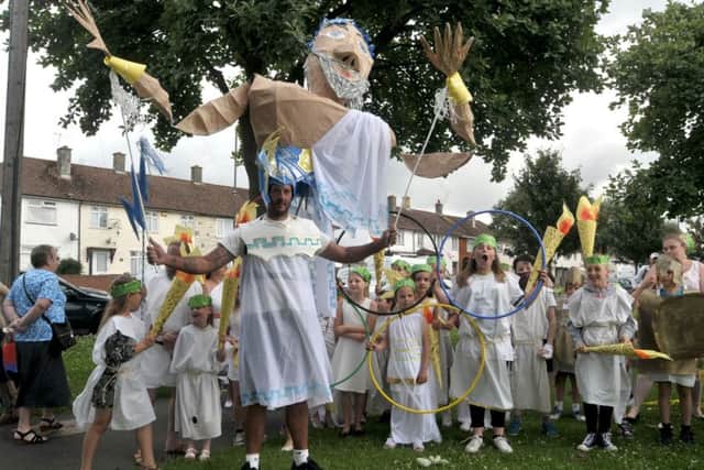 Victory Primary School caretaker Shane Leavers joins pupils for the parade Picture: Mick Young (160767-01)