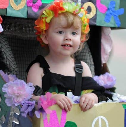 Maisie James watches the Leigh Park Carnival parade
Picture: Ian Hargreaves (160845-1)
