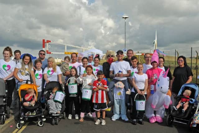 The fundraising walk from Clarence Pier to Cosham, which raised money for The Elizabeth Foundation. Antony Davies, centre, leads the group
Picture Ian Hargreaves (160843-1)