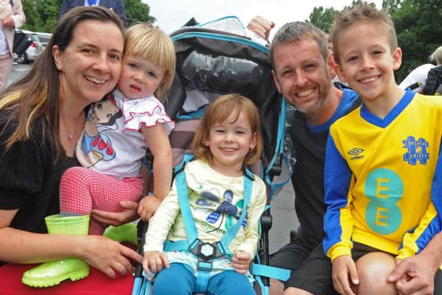 The Macarthur family from Portsmouth - mum Martine and dad Andy with children, from left, Marla, two, Daisy, four, who uses the Rainbow Centre, and Harry, eight Picture: Ian Hargreaves (160846-5)