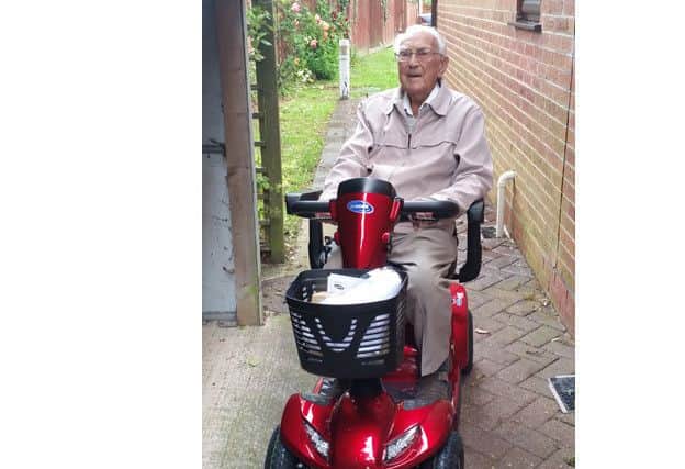 Denis Rawkins on his new mobility scooter