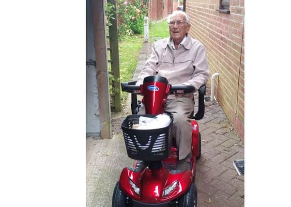 Denis Rawkins on his new mobility scooter
