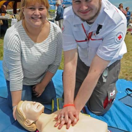 Visitor Evangeline Kitchener, left, with British Red Cross member James Blowman.Picture: Ian Hargreaves (160849-3)