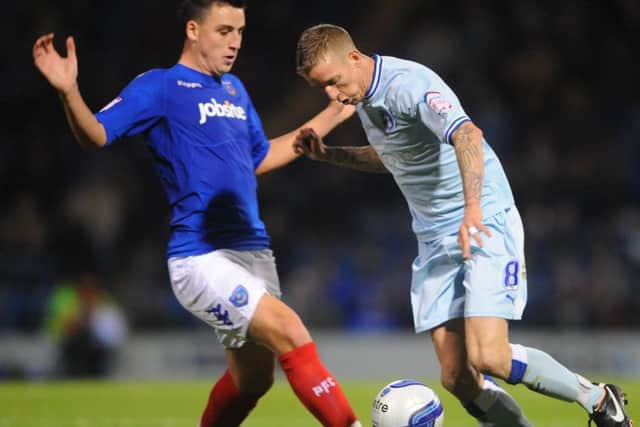 Portsmouth's George Thorne and Coventry City's Carl Baker ENGPPP00220110412161454