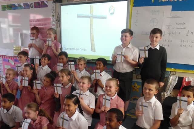 Pupils at St Paul's Catholic Primary School with their handmade crosses