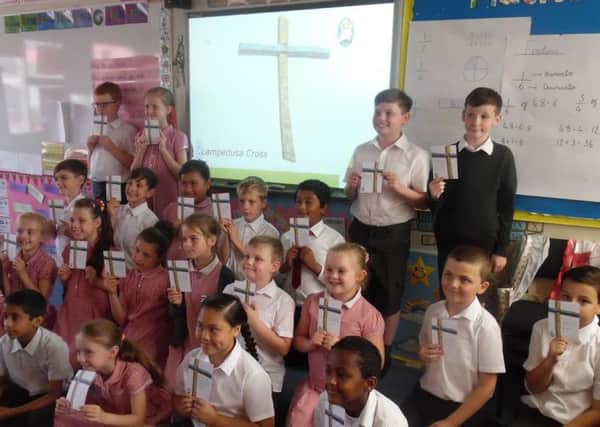 Pupils at St Paul's Catholic Primary School with their handmade crosses