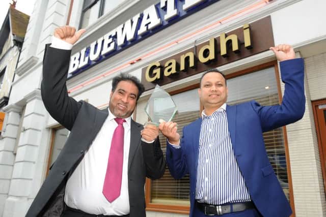 The Ghandi Restaurant in Kingston Road, Portsmouth won Curry House of the Year 2016. Pictured is owner Ruman Karim and manager Shakir Hussain Picture: Sarah Standing (160927-5520)