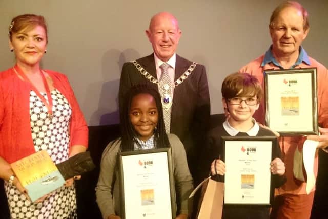 From left, Portsmouth Deputy Lady Mayoress Jo Ellcome, Portsmouth Reader of the Year Tadi Matanhire, Portsmouth Deputy Mayor Ken Ellcome, Portsmouth Reader of the Year Riley Harold and Michael Morpurgo, the winner of Portsmouth Book Award (Shorter Novel) for 2016 Picture: David Percival/School Library Service