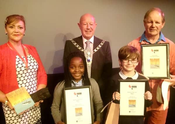 From left, Portsmouth Deputy Lady Mayoress Jo Ellcome, Portsmouth Reader of the Year Tadi Matanhire, Portsmouth Deputy Mayor Ken Ellcome, Portsmouth Reader of the Year Riley Harold and Michael Morpurgo, the winner of Portsmouth Book Award (Shorter Novel) for 2016 Picture: David Percival/School Library Service