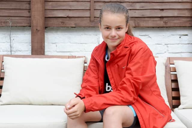 Ruby Burnell, 12, from Southsea, completed a triathlon and raised money for Cancer Research UK Picture: Sarah Standing (160900-4458)