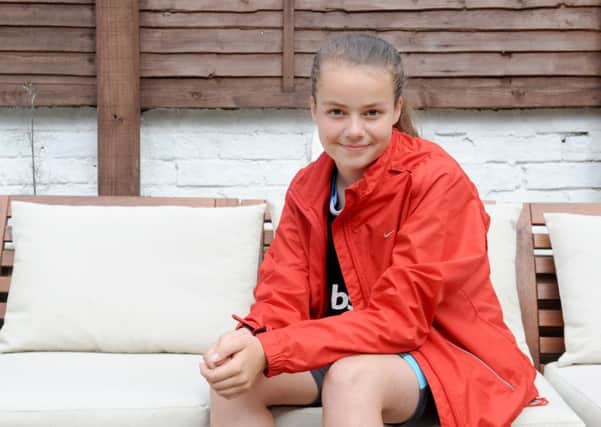 Ruby Burnell, 12, from Southsea, completed a triathlon and raised money for Cancer Research UK 

Picture: Sarah Standing (160900-4458)