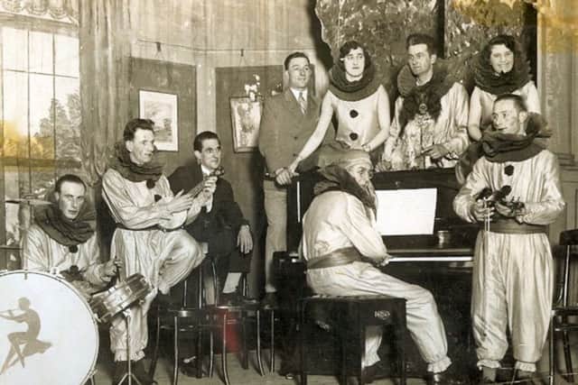 Musicians from branches of the Portsmouth Co-op (Pimco) rehearsing for a panto perhaps? Note the dog on the piano.