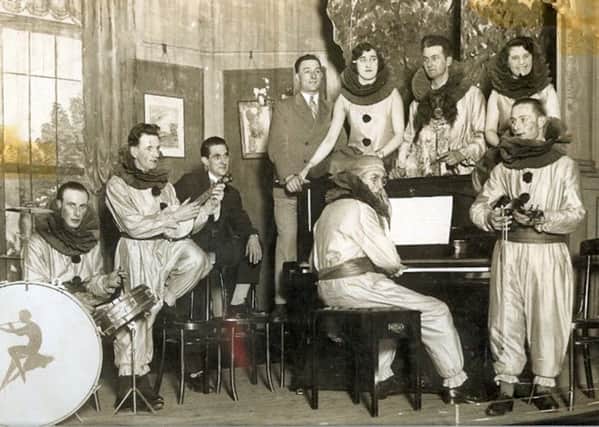 Musicians from branches of the Portsmouth Co-op (Pimco) rehearsing for a panto perhaps? Note the dog on the piano.