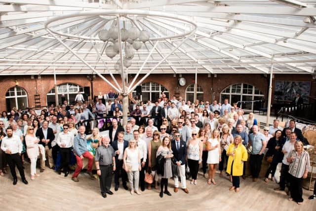 Staff and customers of Aerial Communications marking the firm's 30th birthday on No Man's Fort in the Solent