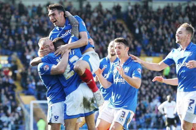 Ben Davies celebrates with Gary Roberts and Kyle Bennett