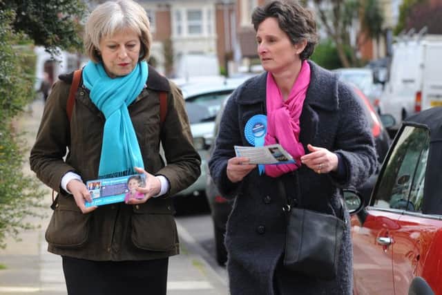 1/4/2015 (MOL)  The UK Home Secretary Theresa May help Flick Drummond with some canvassing on Wednesday in Exeter Road, Southsea.   Pictured is: (l-r) The UK Home Secretary Theresa May with Flick Drummond during canvassing.  Picture: Sarah Standing (150677-5647) PPP-150104-191610001