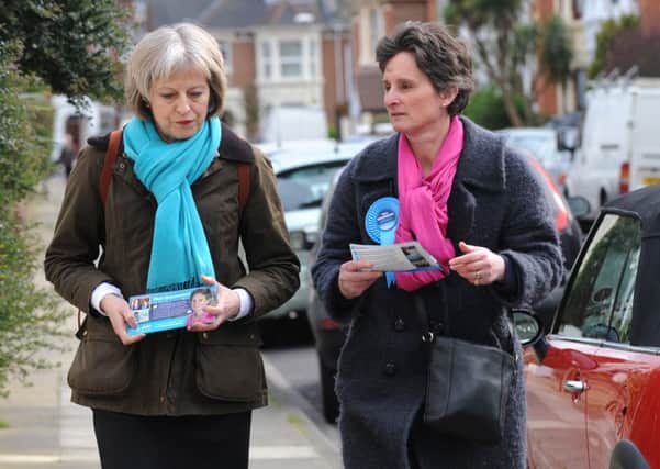 1/4/2015 (MOL)  The UK Home Secretary Theresa May help Flick Drummond with some canvassing on Wednesday in Exeter Road, Southsea.   Pictured is: (l-r) The UK Home Secretary Theresa May with Flick Drummond during canvassing.  Picture: Sarah Standing (150677-5647) PPP-150104-191610001